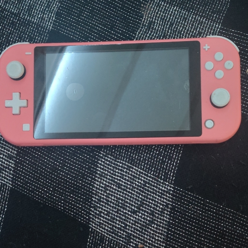 Nintendo Switch Lite Coral With 2 Games ( Mine Craft And Get It Together)